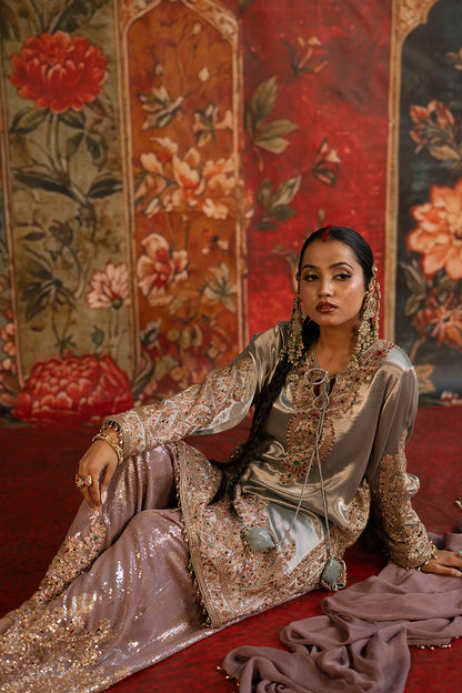 Ivory Banarsi Silk Tissue Kurta Set With Embroidered Borders And Statement Trousers